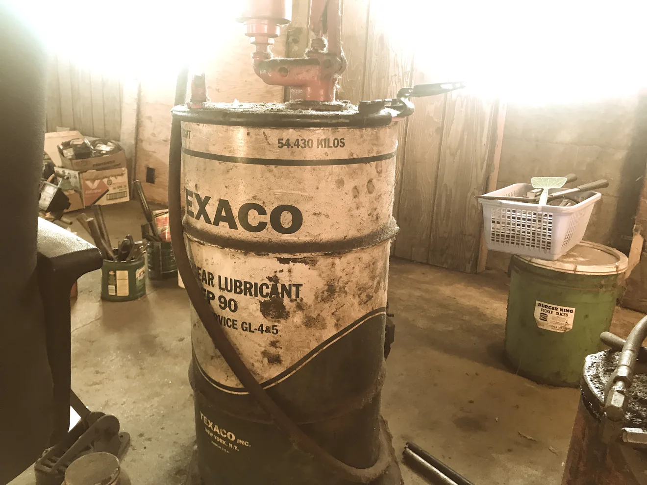 A legacy petroleum drum left at an older property — the kind of pre-existing contamination a Baseline Environmental Assessment documents to protect the new owner